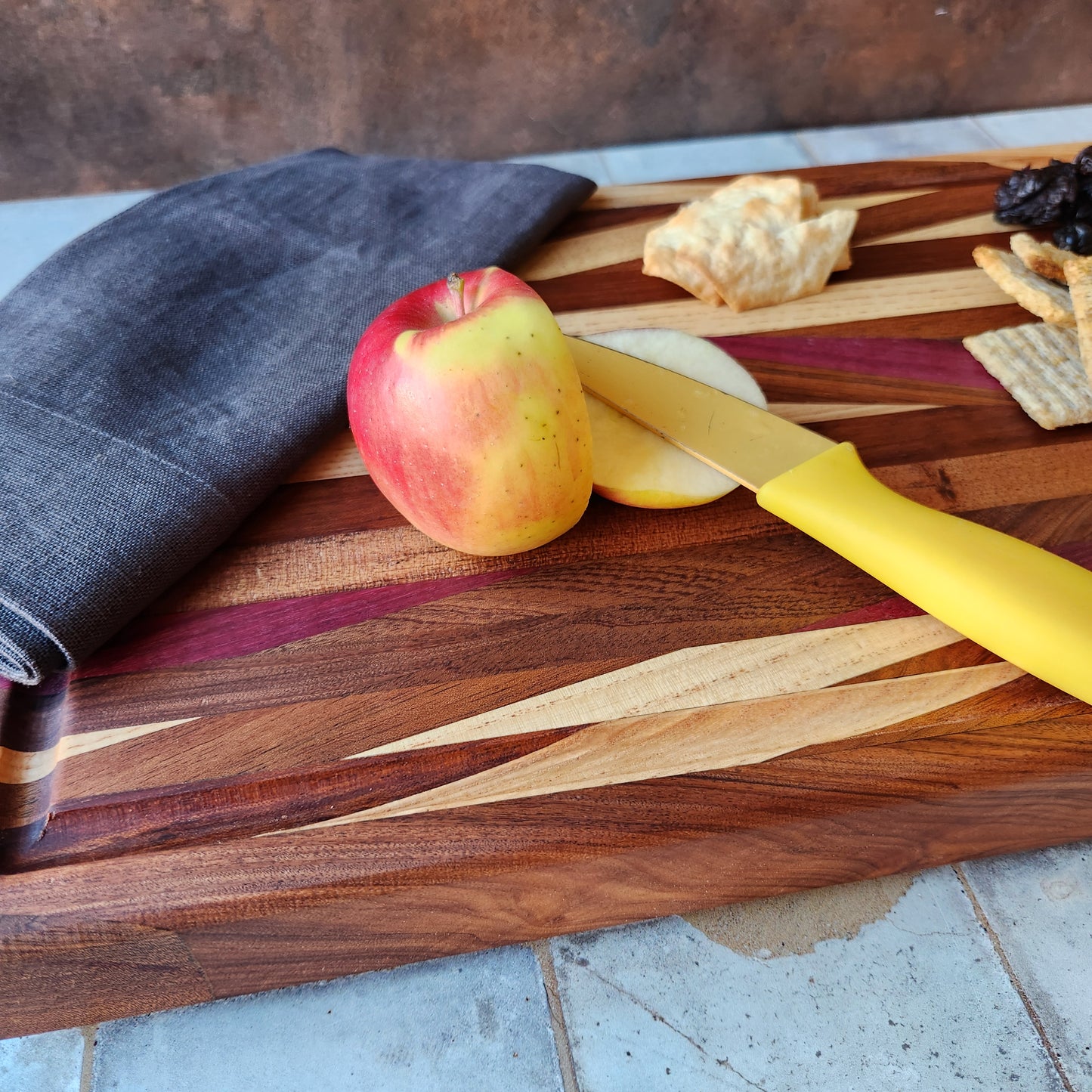 Cutting Board in Purple Heart, Padauk, Black Walnut, Sapele, and Mahogany by Rhino Woodworking