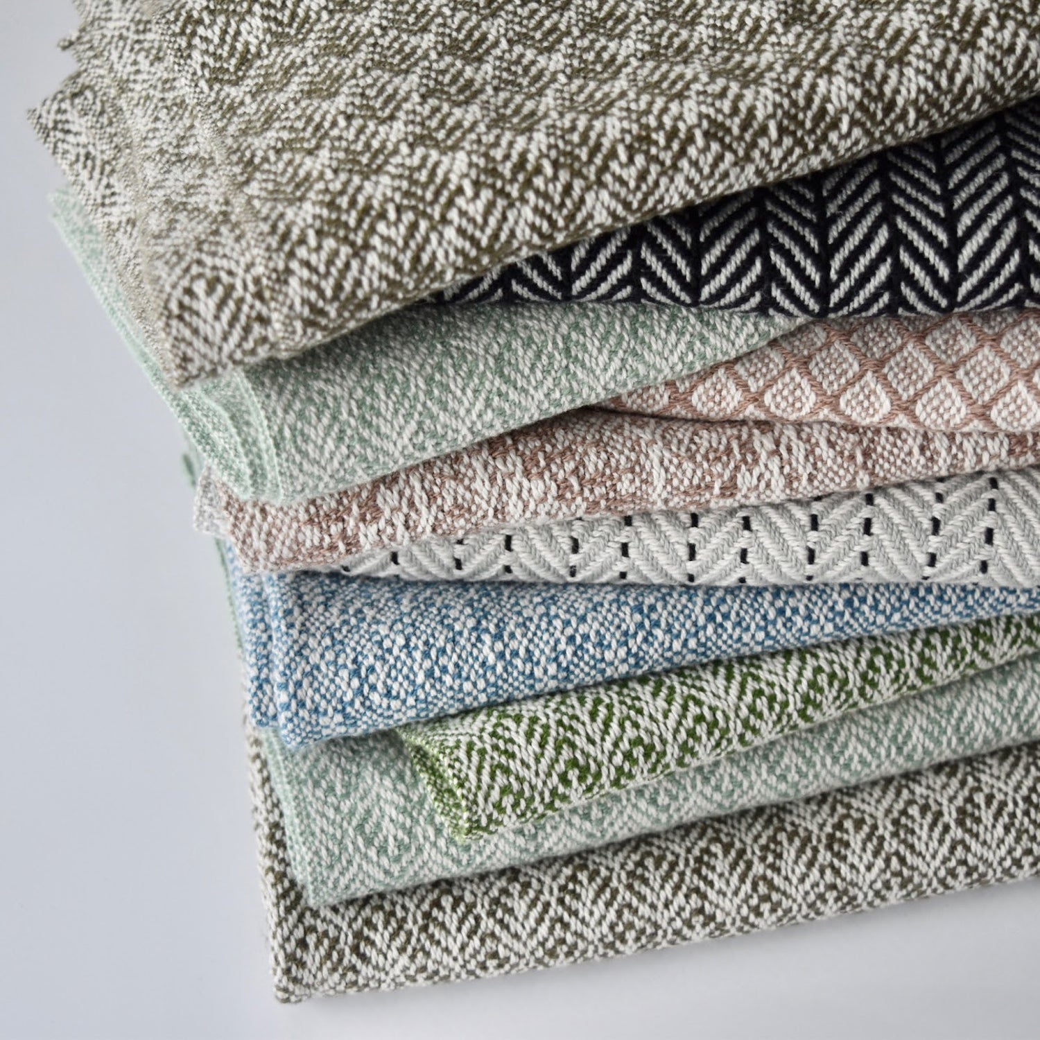 Handcrafted textile tea towels by Kristina Nichols in variety of colors