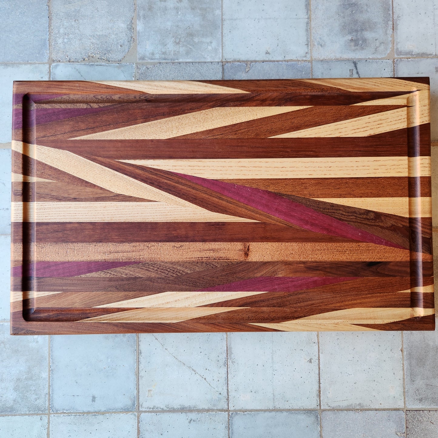 Cutting Board in Purple Heart, Padauk, Black Walnut, Sapele, and Mahogany by Rhino Woodworking