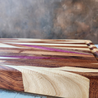 Cutting Board in Purple Heart, Padauk, Black Walnut, Sapele, and Mahogany by Rhino Woodworking