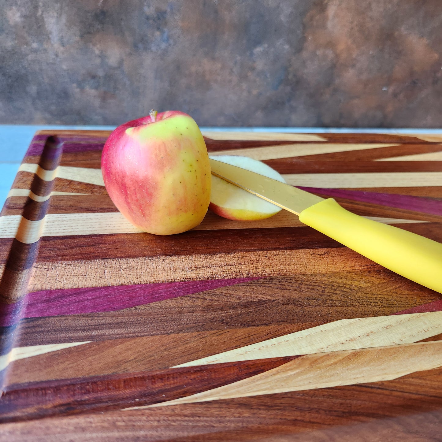 Cutting Board in Purple Heart, Padauk, Black Walnut, Sapele, and Mahogany by Rhino Woodworking