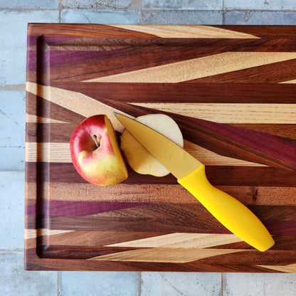 Cutting Board in Purple Heart, Padauk, Black Walnut, Sapele, and Mahogany by Rhino Woodworking