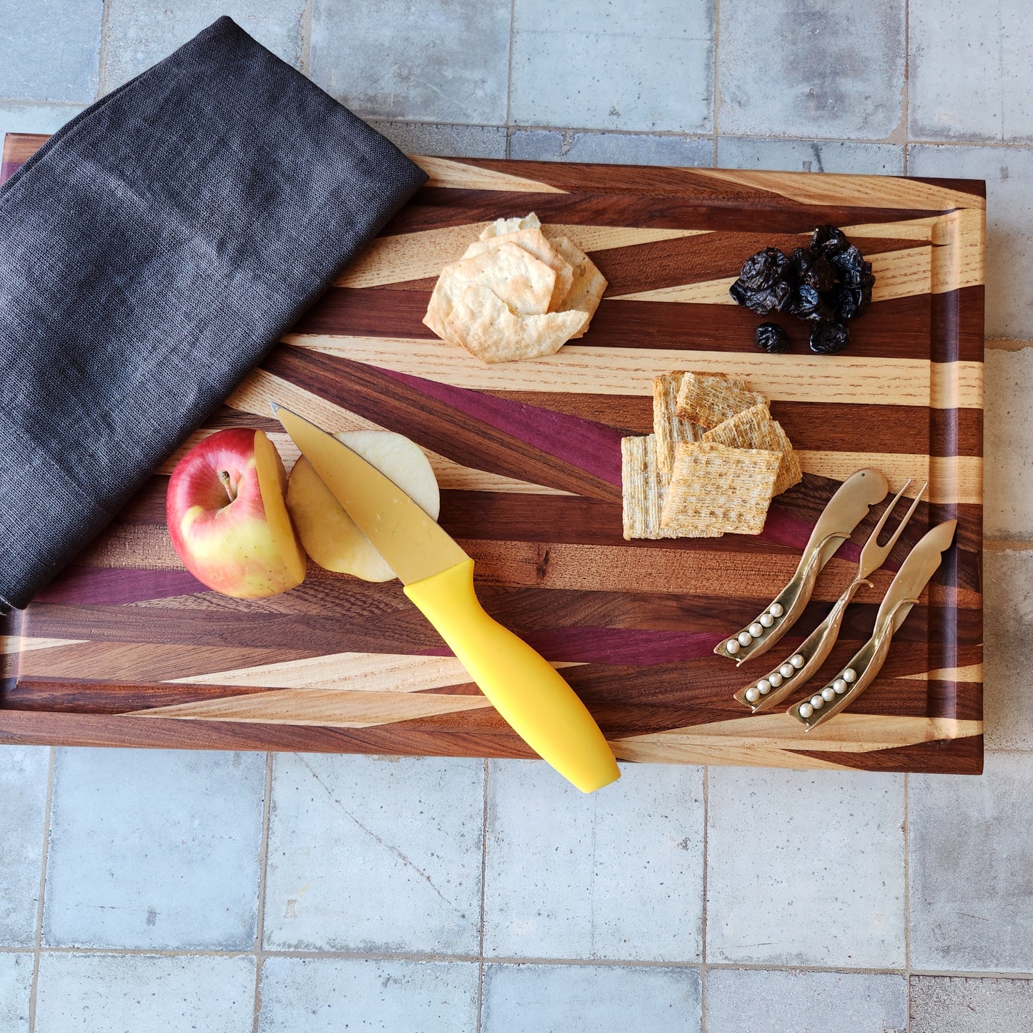 Cutting Board in Purple Heart, Padauk, Black Walnut, Sapele, and Mahogany by Rhino Woodworking