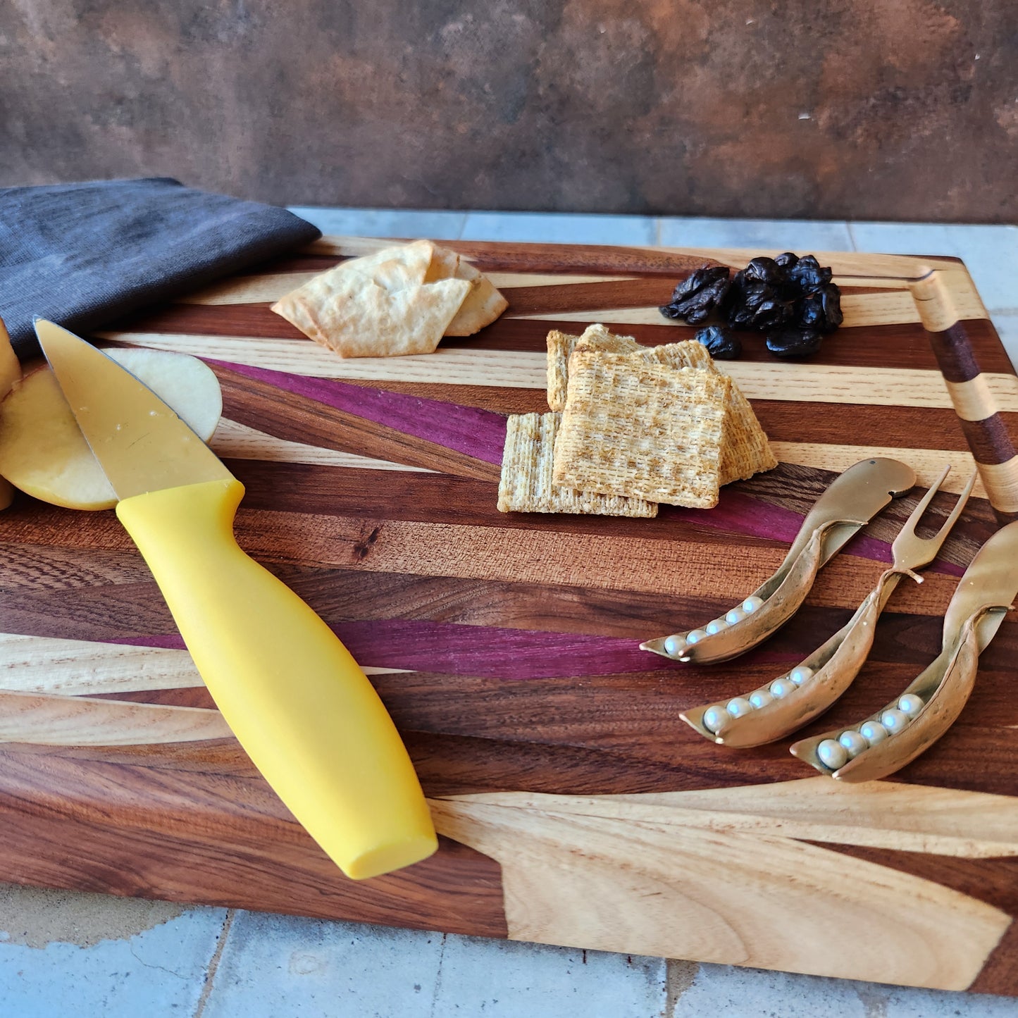Cutting Board in Purple Heart, Padauk, Black Walnut, Sapele, and Mahogany by Rhino Woodworking