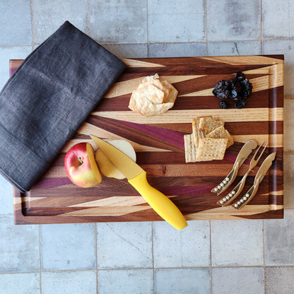 Cutting Board in Purple Heart, Padauk, Black Walnut, Sapele, and Mahogany by Rhino Woodworking