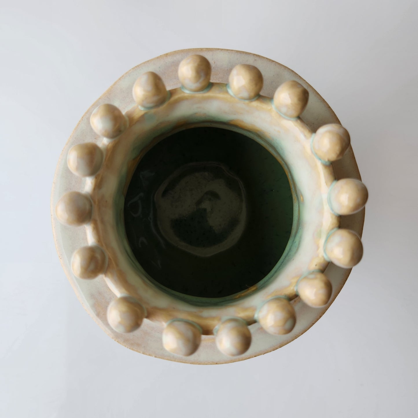 Round Cream Pinched Vase by Rene Stratton