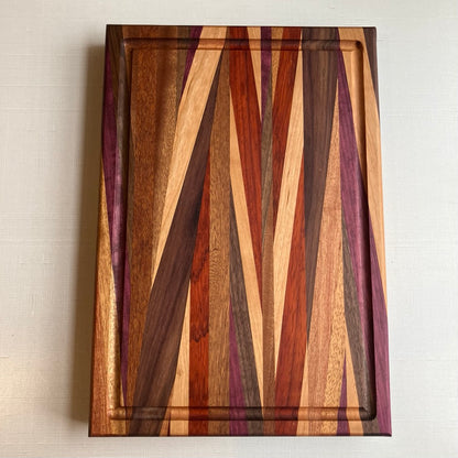 Cutting Board in Purple Heart, Padauk, Black Walnut, Sapele, and Mahogany by Rhino Woodworking