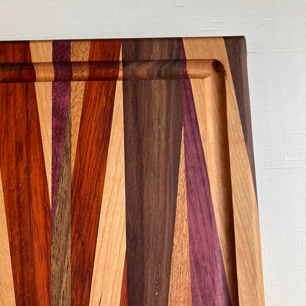 Cutting Board in Purple Heart, Padauk, Black Walnut, Sapele, and Mahogany by Rhino Woodworking