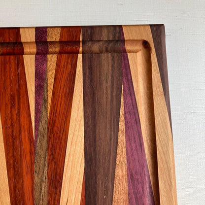 Cutting Board in Purple Heart, Padauk, Black Walnut, Sapele, and Mahogany by Rhino Woodworking