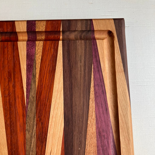Cutting Board in Purple Heart, Padauk, Black Walnut, Sapele, and Mahogany by Rhino Woodworking