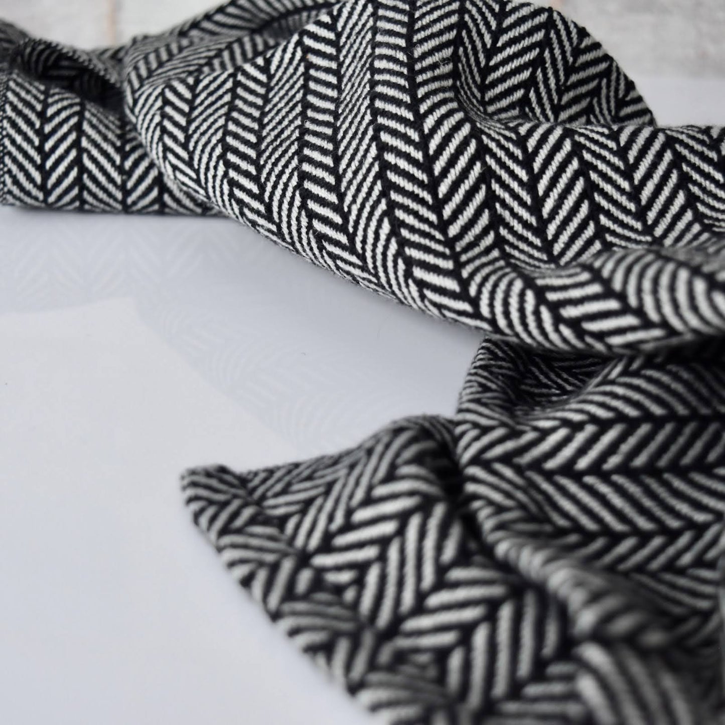Tea Towel / Hand Towel in Black And Grey Chevron by Kristina Nichols