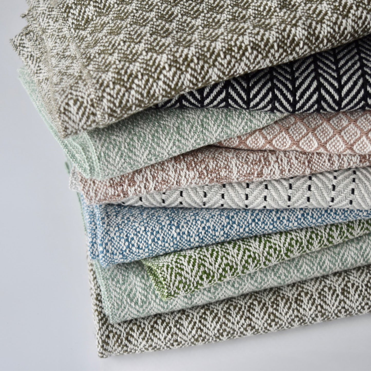 Handcrafted textile tea towels by Kristina Nichols in variety of colors